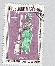 Buy Senegal 264 Woman Pounding Grain Used 1 (BP95412)