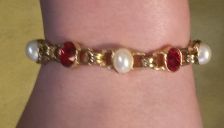 Buy BRACELET, PEARLS & RED FACET STONES IN GOLD TONED CHAIN - Eloquent & Attractive!