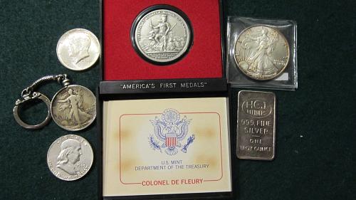 Silver coins plus 1 oz silver bar and silver eagle here it also America's First Medal