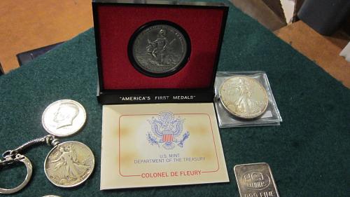 Silver coins plus 1 oz silver bar and silver eagle here it also America's First Medal