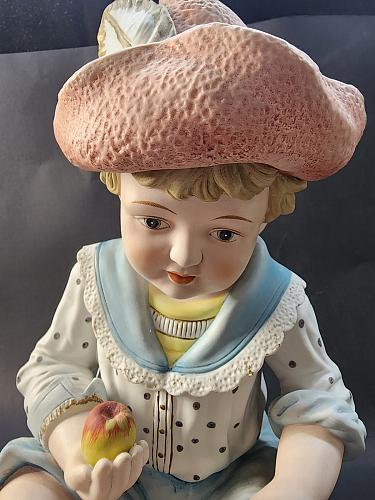 Hand painted bisque Porcelain piano doll