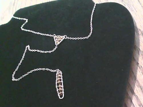 Gold Tone necklace with a triangular pendant and a rectangular pendant
