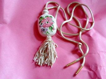 Avon Medallion Hand Painted Floral Porcelain with a Off white Tassel