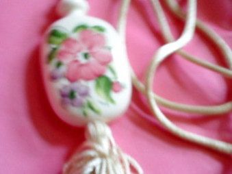 Avon Medallion Hand Painted Floral Porcelain with a Off white Tassel